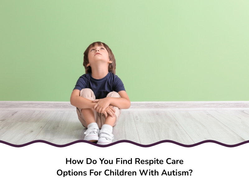 A young boy sits on a wooden floor looking up, symbolising need for respite care for children with autism.