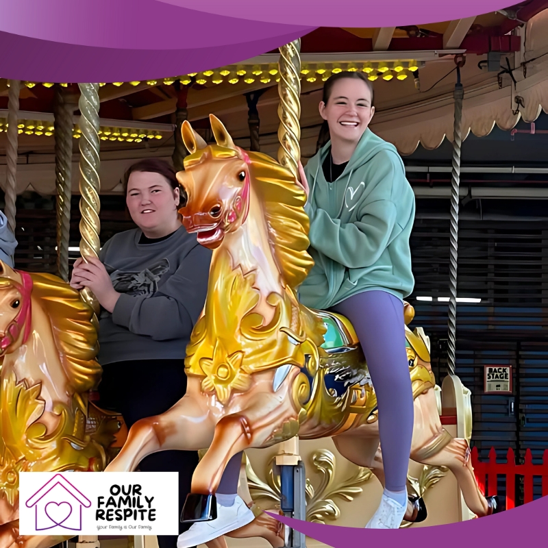 Two riders enjoy a carousel, each mounted on brightly painted golden horses, as part of a respite care for children outing, surrounded by vibrant lights and a lively carnival atmosphere.