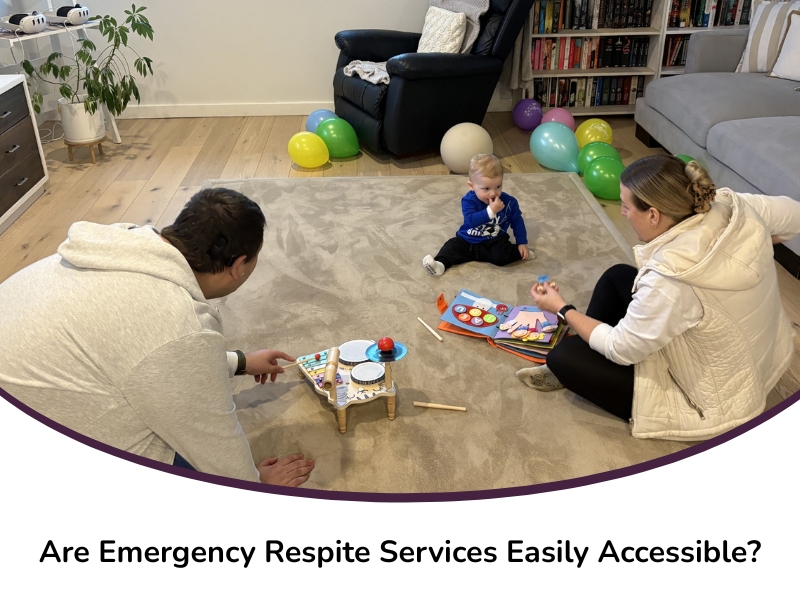 Carers and a toddler playing with musical toys and books indoors, supported by emergency respite services.